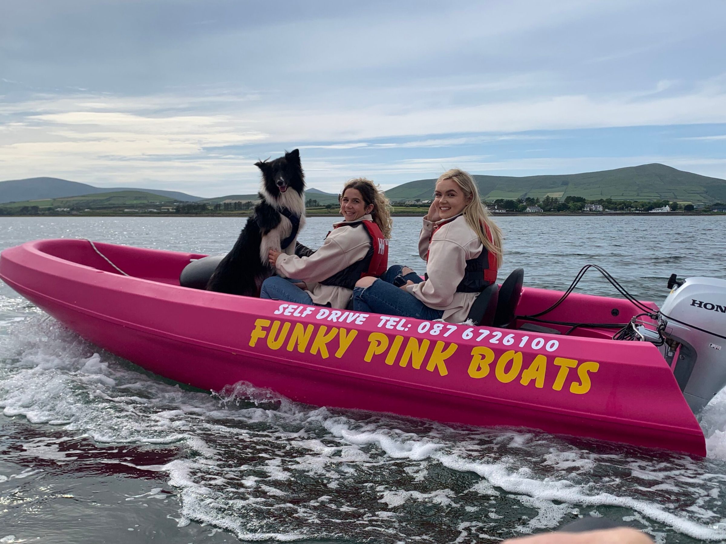 a person riding on the back of a boat in a body of water