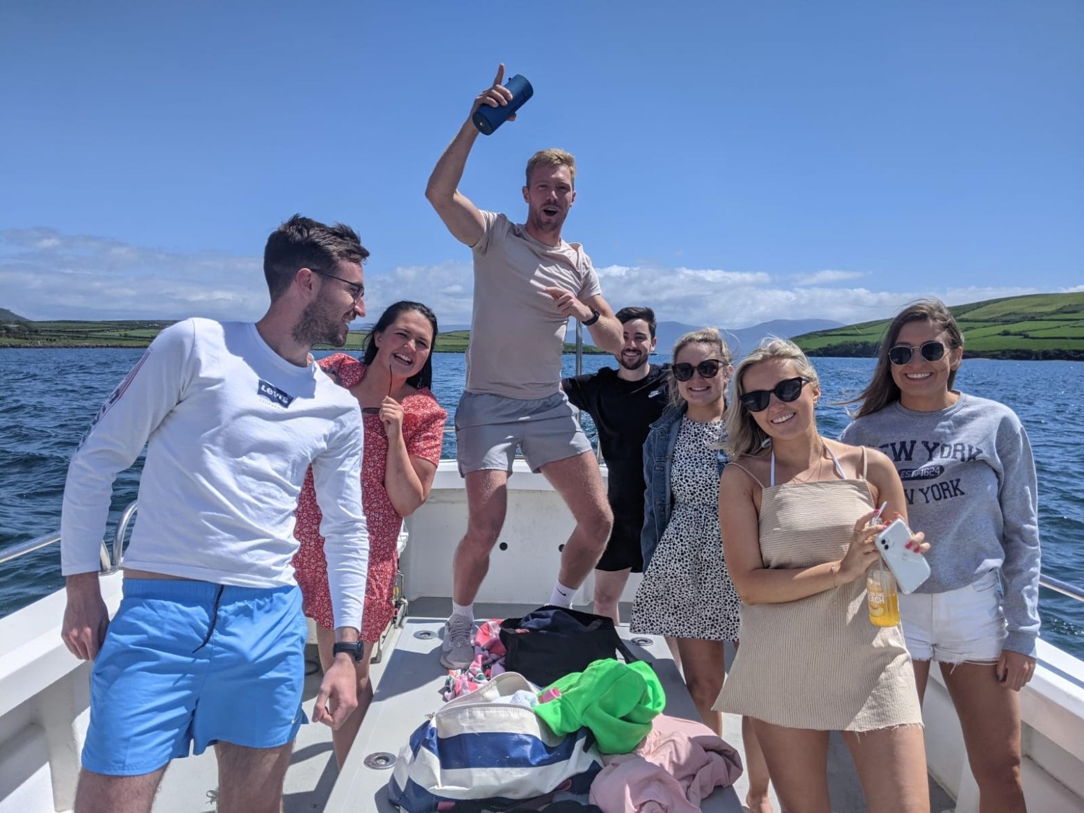 a group of people standing on a boat