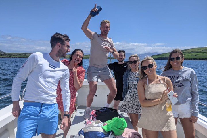 a group of people standing on a boat