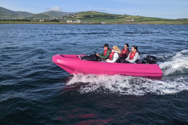 a group of people in a boat on a body of water