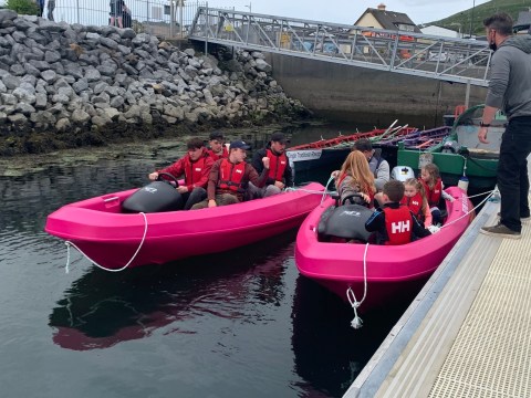 a person sitting on a boat in the water