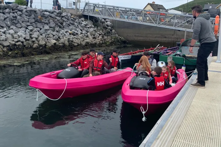 a person sitting on a boat in the water