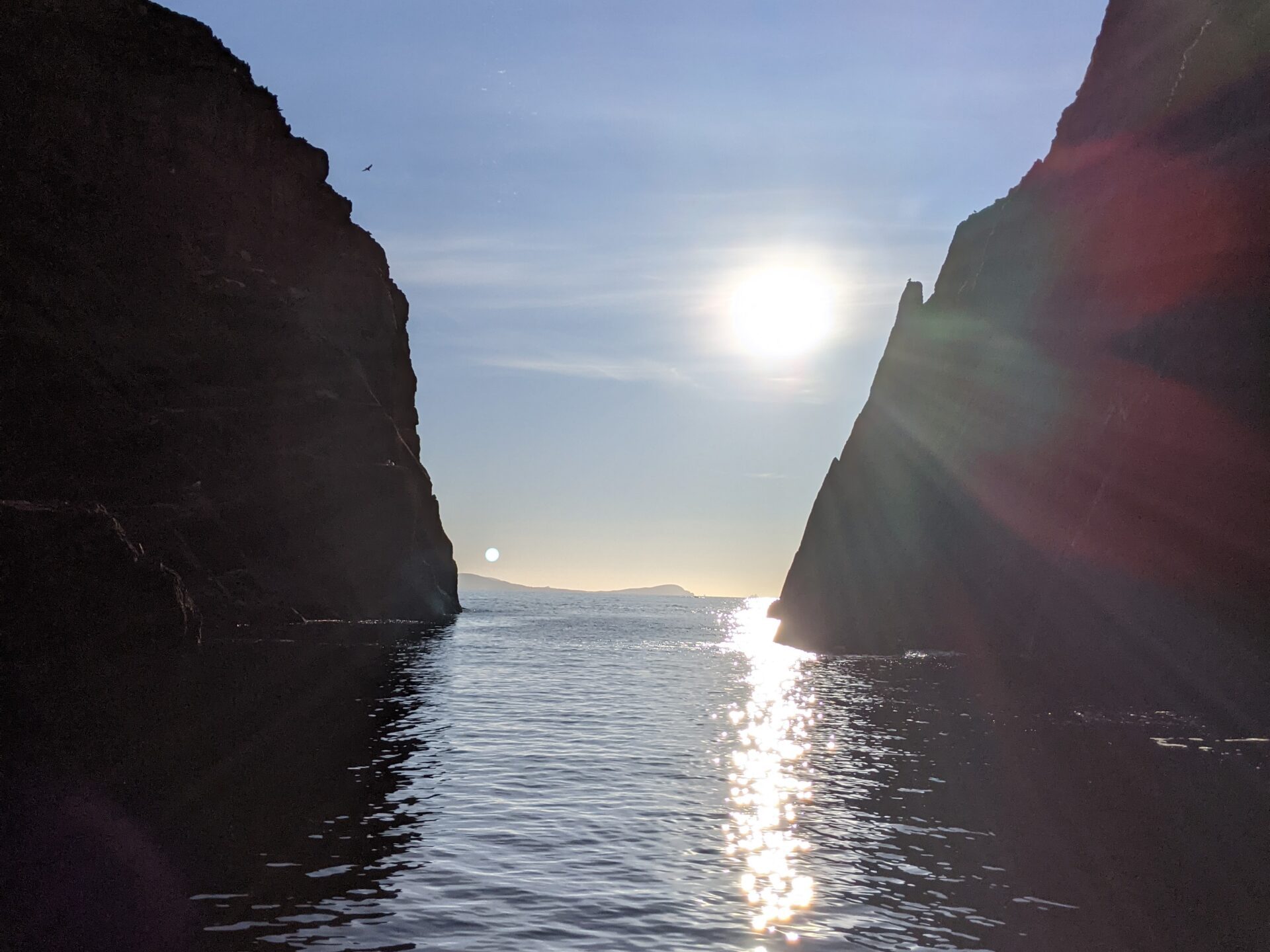 a body of water with a mountain in the background