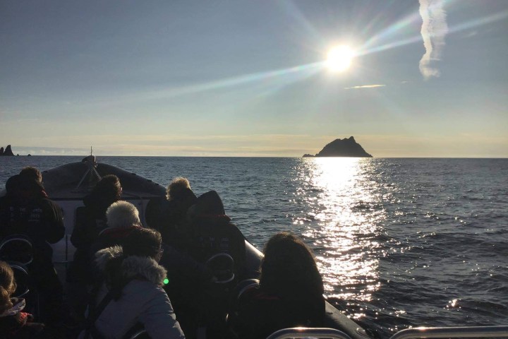 a group of people on a boat in the water