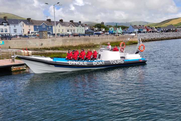 a boat is docked next to a body of water