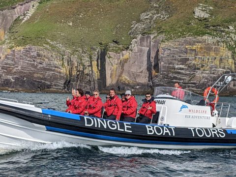 a group of people on a boat in the water