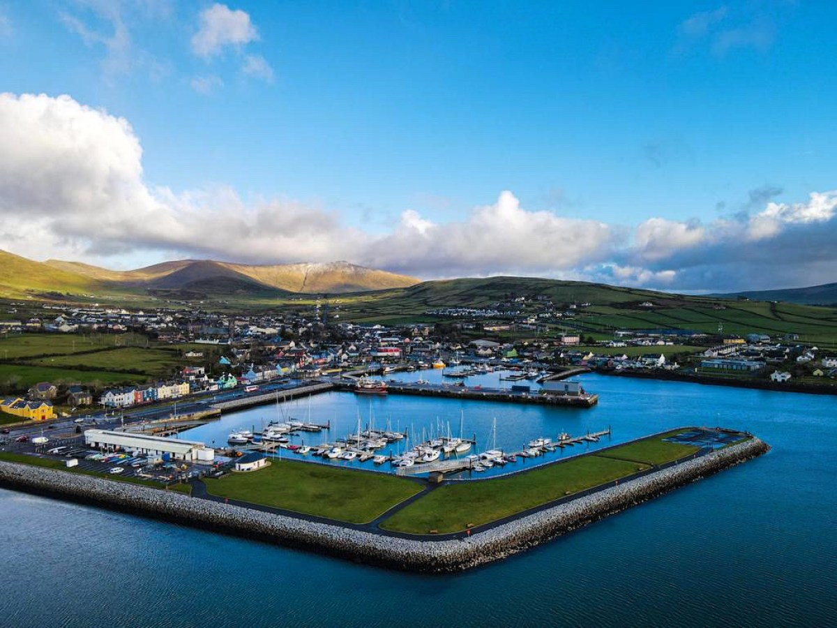 a boat is docked next to a body of water