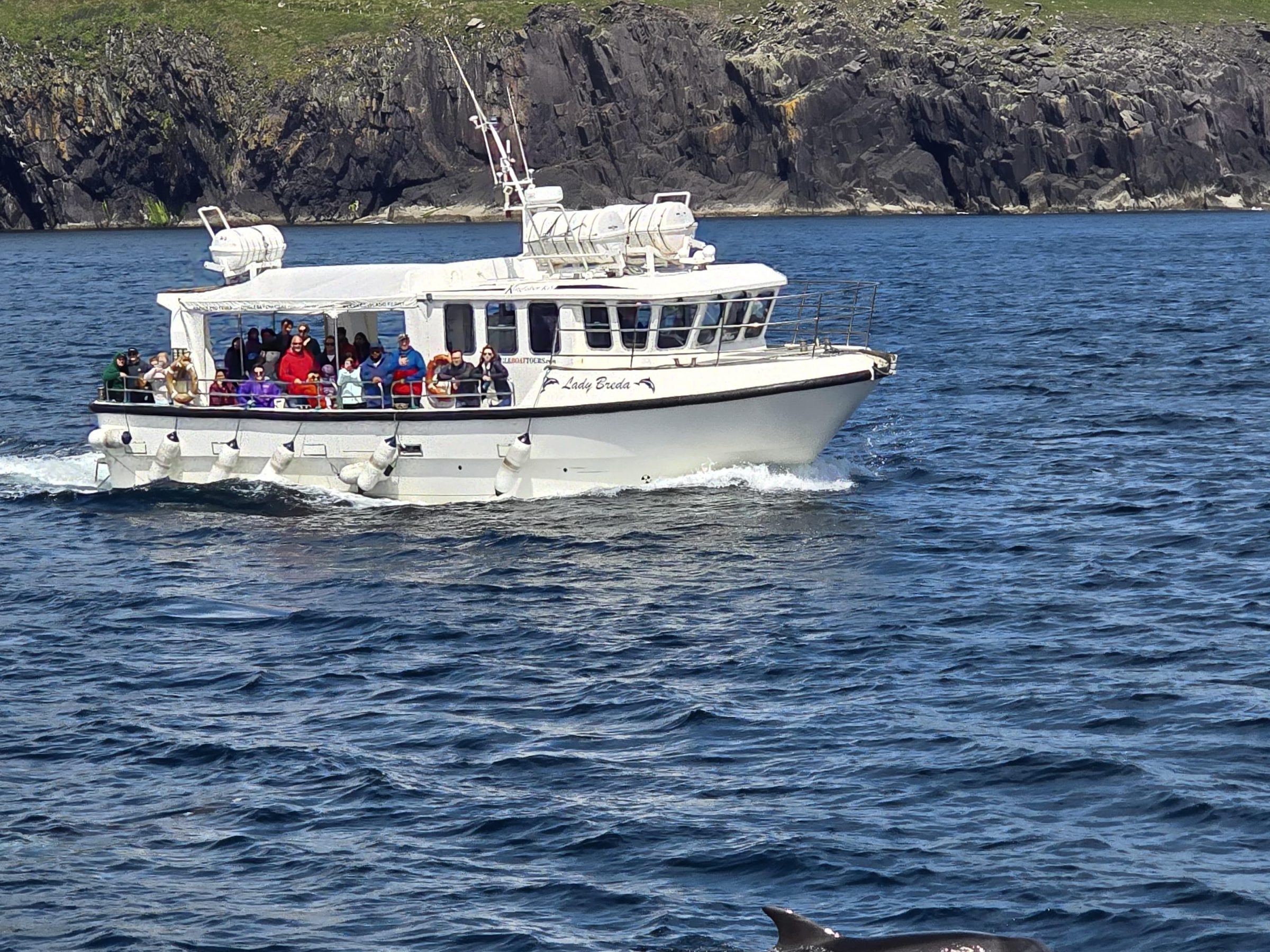 a small boat in a large body of water